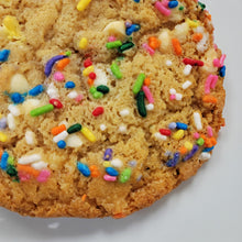 Load image into Gallery viewer, Cookie with colorful sprinkles on a white background
