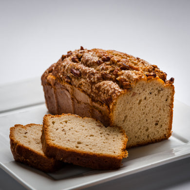 Slices of apple pecan bread on a white plate.